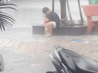 A Boy Hugging A Dog In The Rain After Finding The Dog